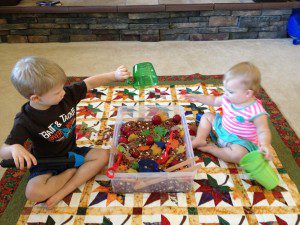 3 and 1 year old - playing with a fall sensory bin together