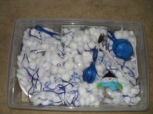 Winter/Snow theme - cotton balls, metallic snowflakes and blue strips, snowmen containers, blue measuring cups, tongs and metal containers