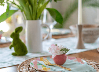 A table setting for Easter brunch with pinks and greens.